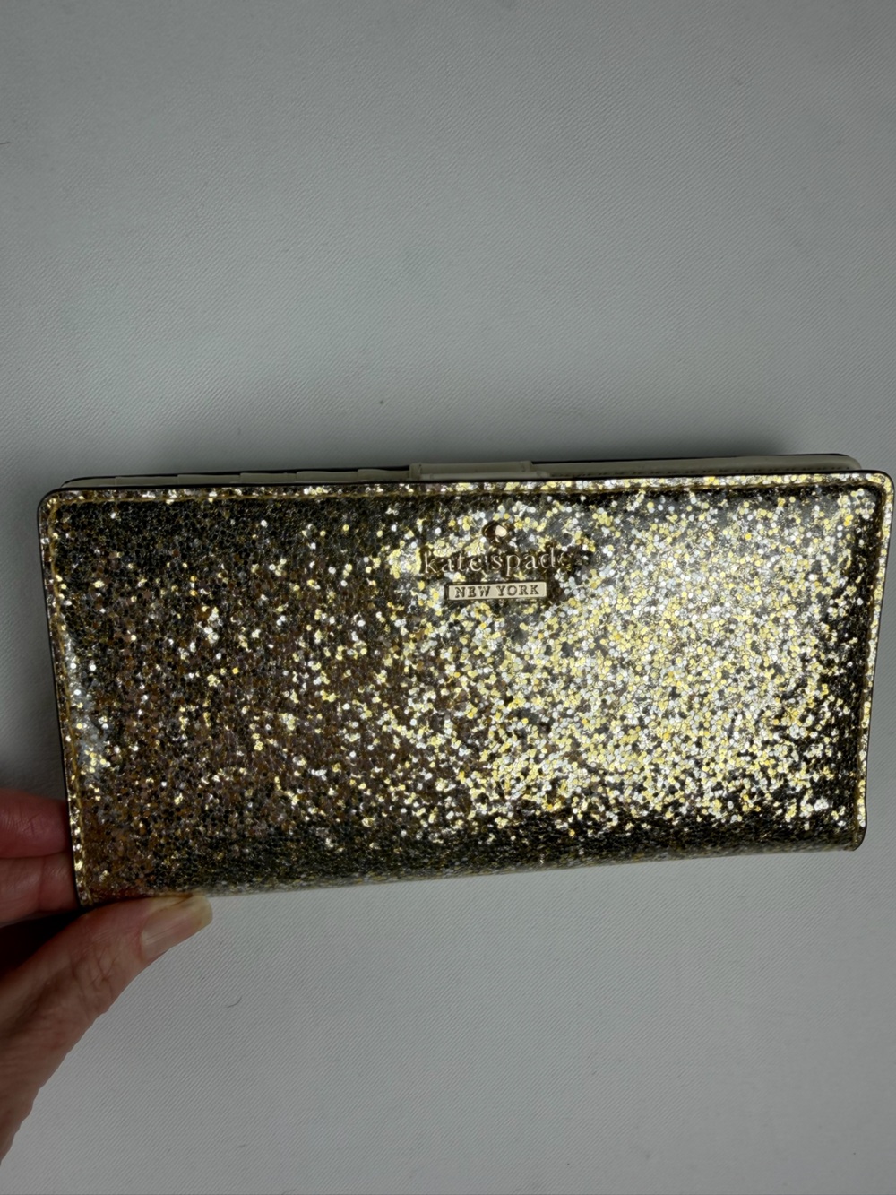 kate spade Gold Glitter Folio wallet with magnetic closure  - fun and flirty